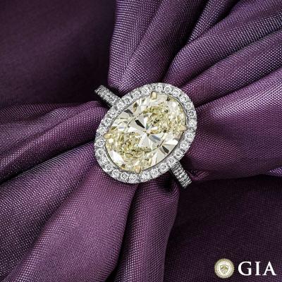 Platinum Fancy Light Yellow Oval Cut Diamond Ring 4.23ct