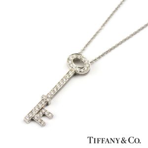 Platinum Tiffany Grain Set Round Brilliant Cut Diamond Oval Key Pendant
